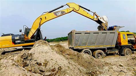 excavators loading dump trucks youtube